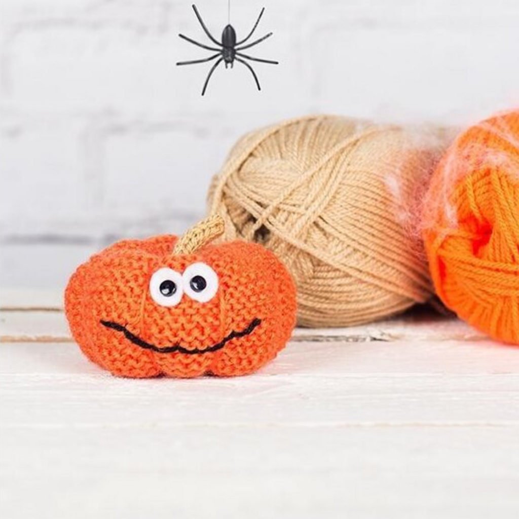 Little knitted pumpkin toy